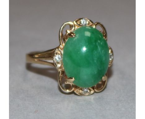 A 14ct gold jade and diamond set dress ring, size O.