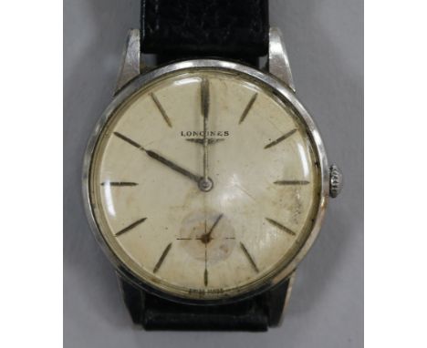 A gentleman's steel Longines manual wind wrist watch.