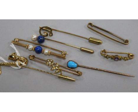 A 9ct gold saxophone stick pin, a similar initial pin and tiepin and five various unmarked items, including a turquoise-set s