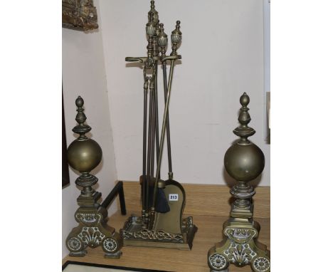 A pair of andirons and fire tools