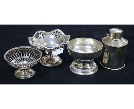 A silver tea caddy, a silver pedestal dish, a pierced white metal pedestal dish and another pierced pedestal dish