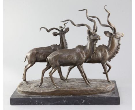 A bronze of three ibex