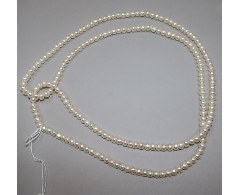 An opera length single strand cultured pearl necklace, 116cm.