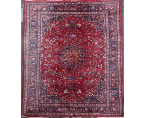 A Tabriz red ground carpet, 292 x 380cm