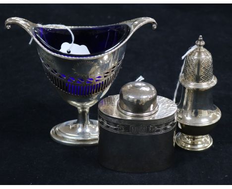 An Adam style silver sugar vase with blue glass liner, a small silver tea oval caddy and a large baluster pepper the sugar va