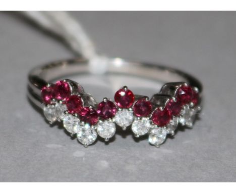 A ruby and diamond zig-zag line-set ring, 18ct white gold shank