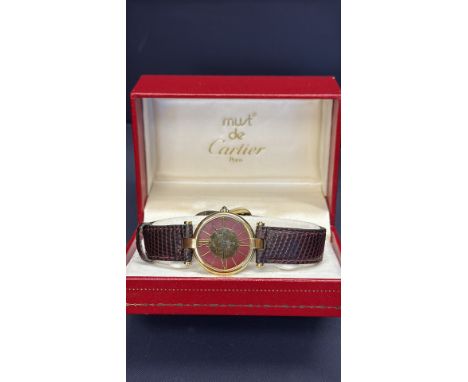 Cartier Must de Cartier ladies watch features quartz movement, gold plated, 925 silver, leather strap, and Paris hallmark wit