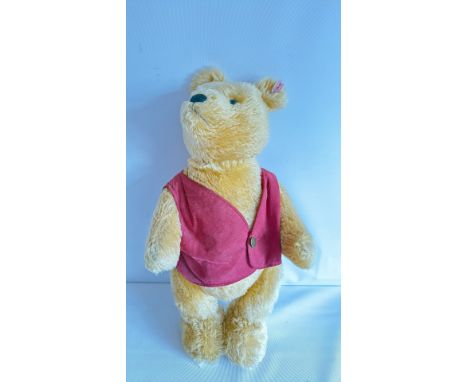 Steiff Winnie the Pooh plush toy with signature red shirt, comes with embroidered storage pouch. Made in Germany.