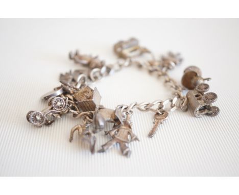 Silver charm bracelet - 14 charms 