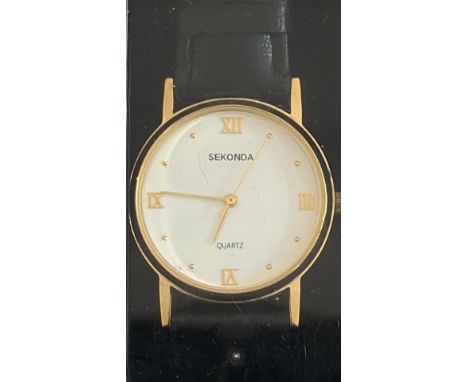 Gents Sekonda quartz watch features a gold-tone case, white dial with Roman numerals, and a black leather strap. Currently ti
