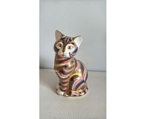 Royal Crown Derby paperweight, cat figurine, English bone china, gold detailing, colorful striped pattern.