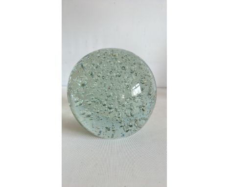 Vintage glass paperweight with controlled bubbles, clear with greenish tint.