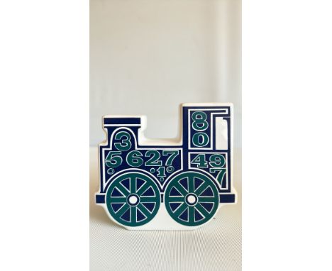 Rare Carlton ware ceramic train-shaped vase, white with blue decorative elements.