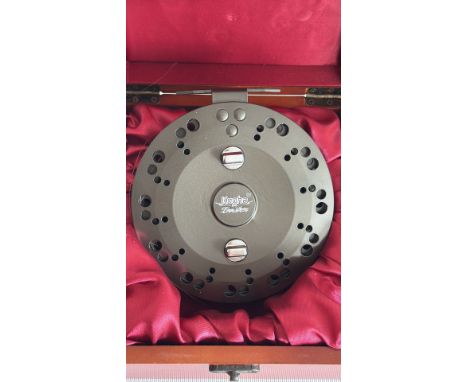 Kogha fly fishing reel, model River Spire, with wooden handle accents, presented in a red-lined wooden box.