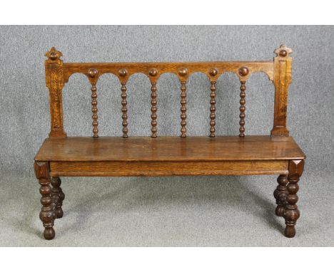 A Jacobean style bobbin turned oak bench seat, late 19th/early 20th century. H.97 W.134 D.37cm. 