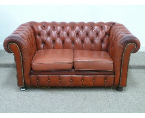 Two seat Chesterfield sofa in red buttoned leather, W148cm