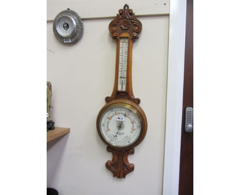 Edwardian carved oak cased aneroid barometer with thermometer retailed by R.Cheff Bird Hull 
