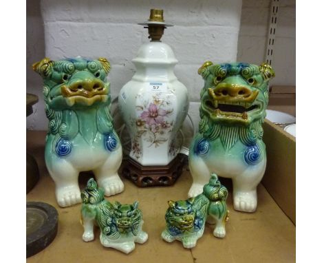 Two pairs of ceramic Chinese dogs of foe and an oriental design table lamp 