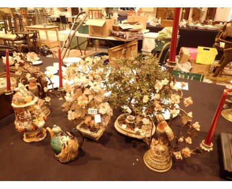 Three decorative Oriental hardstone Bonsai trees with figurines to base and a pair of three branch metal candlesticks with ce