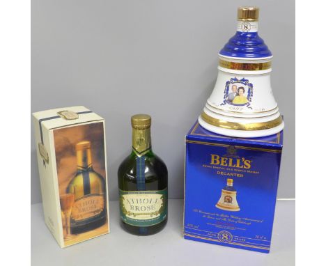 Two bottles; Dunkheld Atholl Brose scotch liquer and a 1997 Bell's The Queen's 50th Wedding Anniversary decanter with content