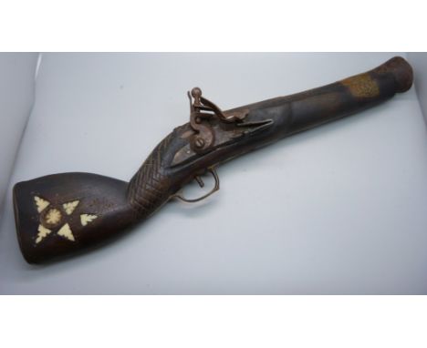 A flintlock overcoat pistol 