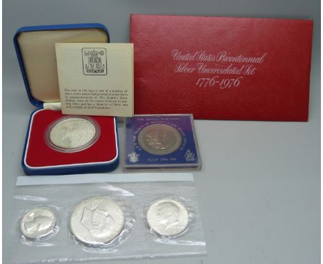 A Royal Mint 1977 silver crown, three USA 1976 Bi-Centenary coins and a 1981 Royal Wedding crown 