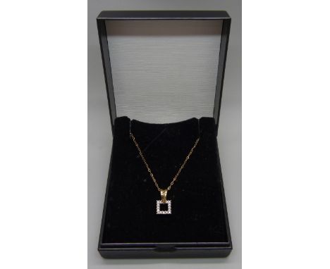 A 9ct gold and fifteen stone diamond pendant on a fine 9ct gold chain 