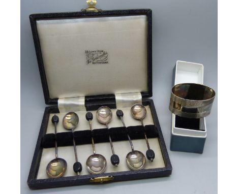A cased set of six silver coffee bean spoons by Elkington and a silver napkin ring, 60g 