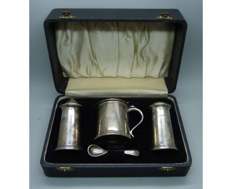 A silver salt, pepper and mustard with mustard spoon, 240g, cased 