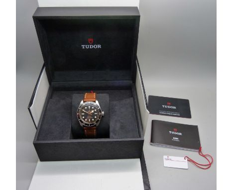 A Tudor Black Bay wristwatch, with box, guarantee and manual, 79030N, Delugs replacement strap 