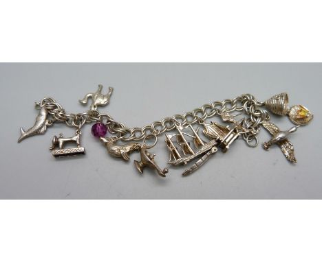 A silver charm bracelet, 40.1g 