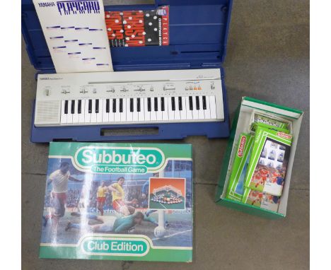 A Yamaha Portasound PC-50 keyboard and a Subbuteo Club Edition game with two extra teams and scoreboard 