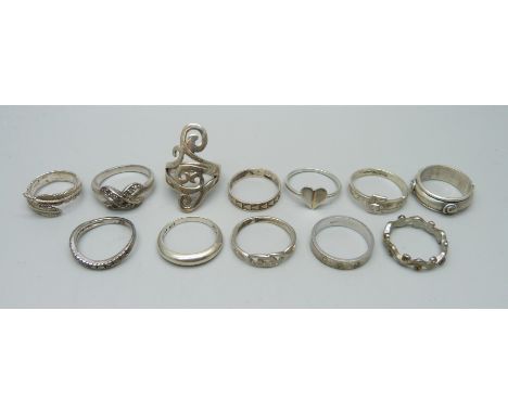 A 9ct gold ring, 3g, nine silver rings, 28g, and two plated rings 