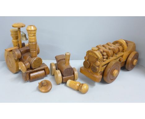 Two Paul Reardon hand made wooden models of a car and a steam roller, together with another wooden model 
