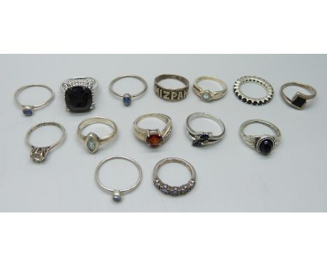 Ten silver rings, three white metal rings and a plated ring, 39g 