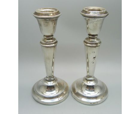 A pair of silver candlesticks, 14cm 