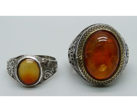 Two silver and amber rings, sizes X and Z 