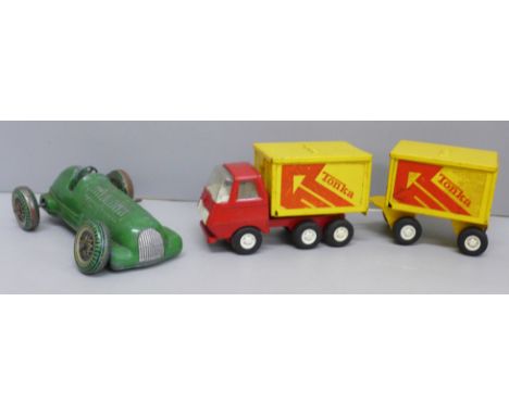 A Tonka toy lorry and trailer and a Mettoy clockwork racing car, a/f 