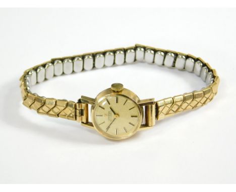 OMEGA. A lady's 9ct. gold cased Omega automatic wristwatch on replacement gold plated strap.  All watches in this auction are