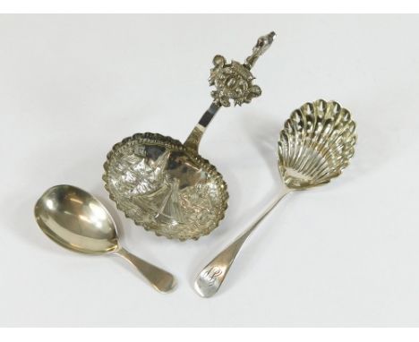 SILVER SPOONS. Three silver spoons: a plain caddy spoon, Sheffield 1912; a small sifter spoon, by Walker & Hall, Sheffield 19