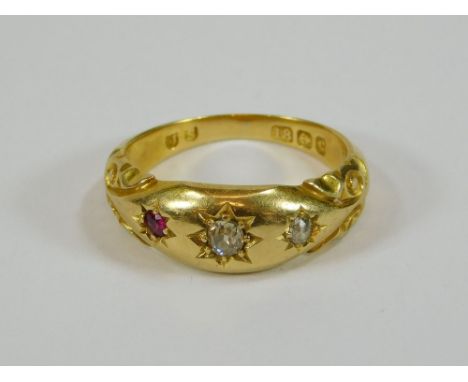 GOLD RING. An 18ct. gold ring with two gypsy set diamonds & a single ruby. (Re-sized). Size I. Approx. 5g.  Please note that 