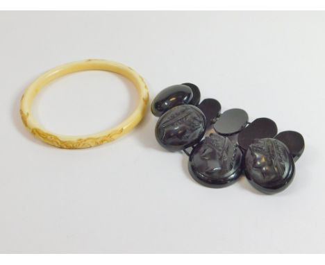 VICTORIAN BRACELET. A Victorian composition cameo bracelet, elasticated. Also, a dragon-carved, Chinese ivory bangle.  Please