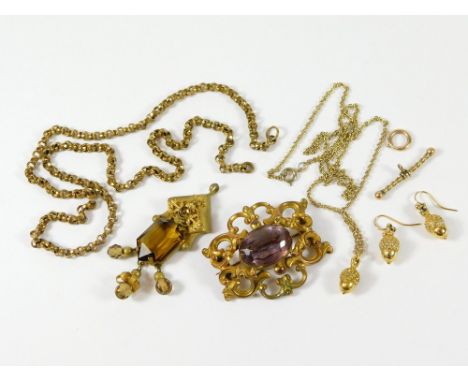 AMETHYST BROOCH ETC. A 19th century gilt metal & amethyst brooch, a gilt metal & paste pendant, a gold plated acorn pendant &