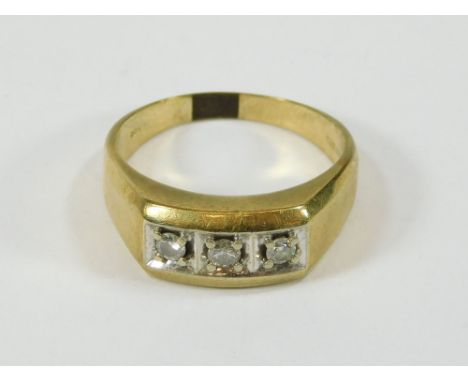 GOLD RING. A gentleman's 9ct. gold ring set with three cubic zirconias. Size Y/Z.  Please note that all items in this auction