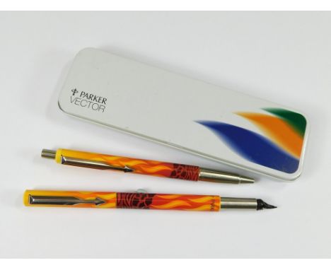 PARKER VECTOR. A gold & red flame effect Parker Vector pen & ballpoint pen set in white metal presentation box. C.1990s.  Ple