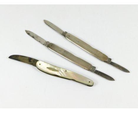 POCKET KNIVES. A pair of mid-1940's engine turned silver pocket knives by Walker & Hall. (One with naming). Also, one other p
