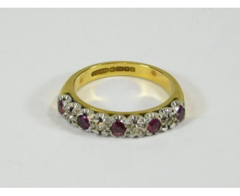 GOLD RING. An 18ct. gold half-hoop, ruby & diamond eternity ring. Size N. Approx. 4.8g.  Please note that all items in this a
