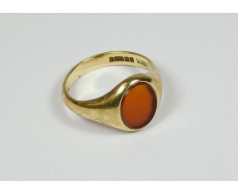 SIGNET RING. A gentleman's 9ct. gold carnelian signet ring. Size U/V. Approx. 6.4g.  Please note that all items in this aucti