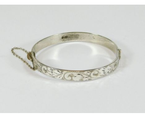 SILVER BANGLE. A contemporary silver bangle.  Please note that all items in this auction are previously owned & are offered o