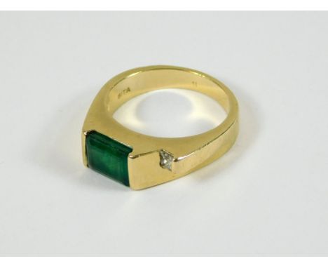 EMERALD RING. A modern 14k emerald & diamond dress ring. The octagonal emerald approximately 6.2mm x 3.1mm. Size M/N. Approx.